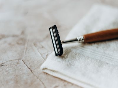 Reusable Razor on a white towel on countertop