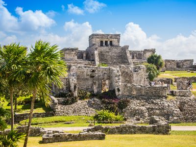 Mayan ruins against blue sky in Tulum, Mexico