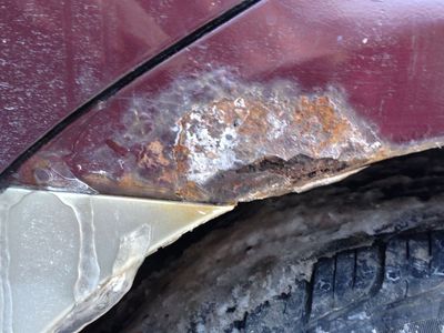 A patch of rust on a car