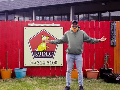 Myles Stubblefield stands in front of his dog training and worm business