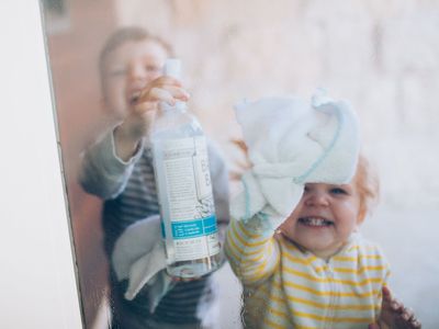 kids cleaning a window