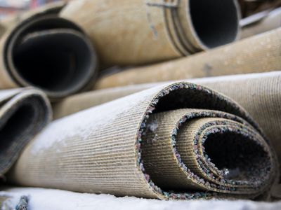 Carpet rolls trowed out for garbage