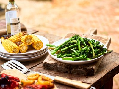 Dishes with freshly prepared green vegetables and sweetcorn