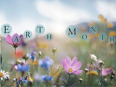 The words Earth Month are written on top of an image of a meadow