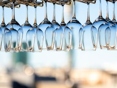 Wine glasses hanging upside down on racks