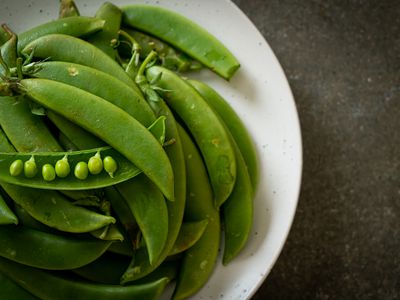 Fresh sweet green peas on plate,Romania