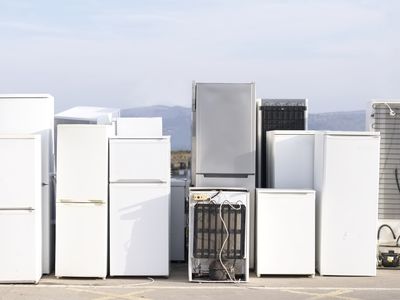 Fridges stacked in a row for recycle used refrigeration units pollution gas