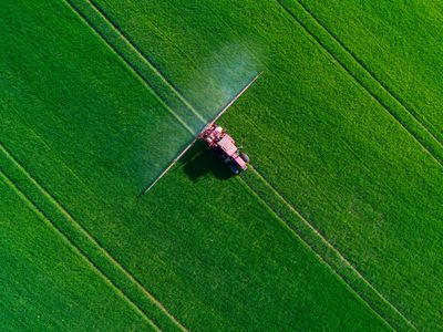 Tractor spraying field