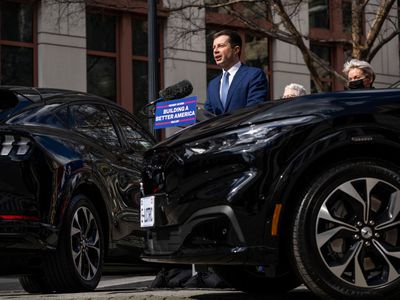 Secretary of Transportation Pete Buttigieg with electric cars