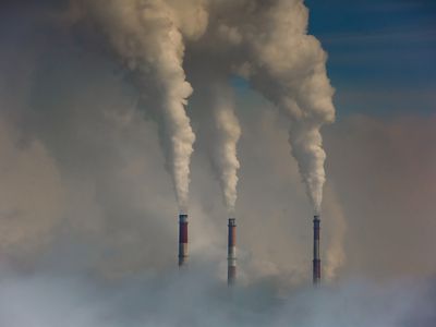 Smoke Emitting From Chimney Against Sky 