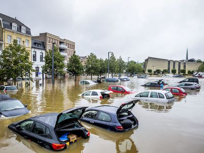 Cars are seen floating in a flooded street on July 15, 2021 in Valkenburg, Netherlands. 