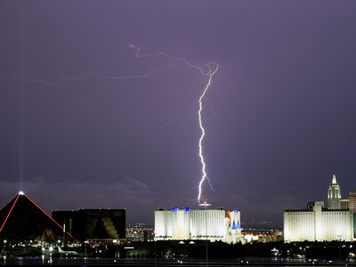 Lightning flashes behind downtown Las Vegas, Nevada.