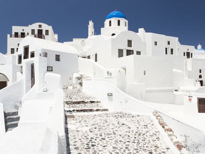 greek hill town with white buildings