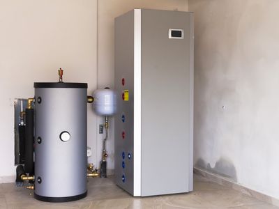 A heat pump water heater installed in a basement