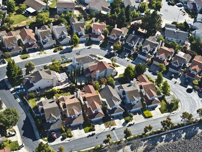 A cul de sac of two-story suburban tract homes in Southern California.