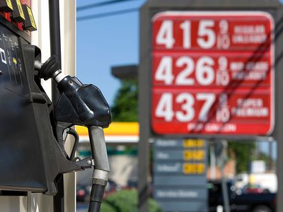 Sign at a gas station of gasoline over $4.00 per gallon.