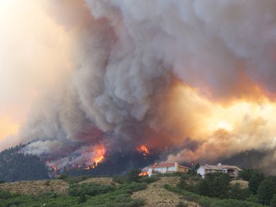 A wildfire burning near a Colorado