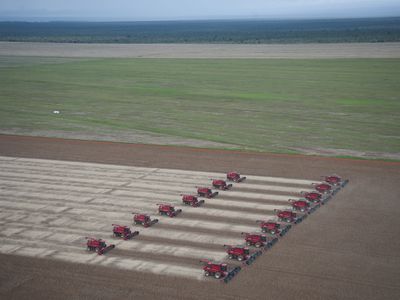 Combines to harvest soybeans sit at the Morro Azul farm about 70km from Tangara da Serra , Mato Grosso, Brazi