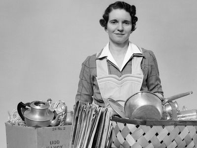 Woman collecting scrap aluminum for war effort