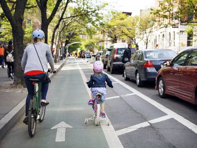 woman and child on bikes in New York Citry