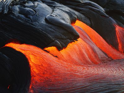 Streams of lava pouring during eruption of Kilauea volcano, Hawaii