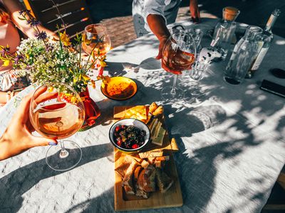 Group of female friends drinking wine outside.