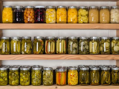 shelves with jars of home preserves