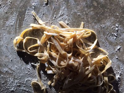 Homemade pasta complete with flour still on it.