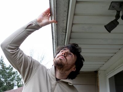 how to inspect for mold man with gutter