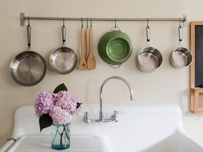 Pink hydrangea arrangement on a kitchen sink