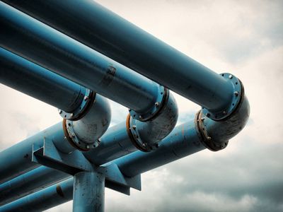 Detail of giant blue-colored water pipes, a peculiar system used to pump away ground-water from flooded foundations of construction sites.