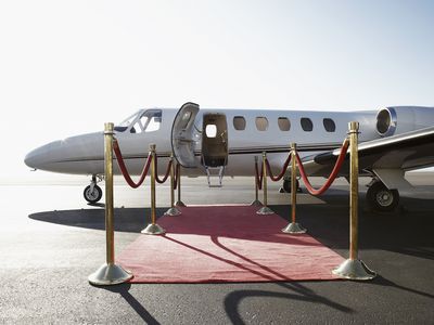 Private airplane with red carpet 