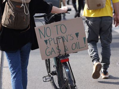 Supporters of the Fridays for Future climate action movement, including one holding a sign that reads: "No to Putin's Gas and Oil!", march as part of a global climate strike on March 25, 2022 in Berlin, Germany. The movement is calling particular attention to the current Russian war in Ukraine, warning that the war is distracting world leaders from achieving climate goals and highlighting the need for a faster global reduction in fossil fuel dependence. 