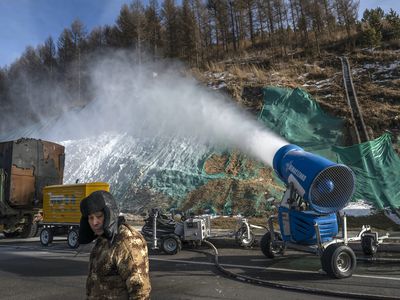 snow-making machine sprays hillside in Zhangjiakou, China, ahead of Beijing 2022 Olympic Games