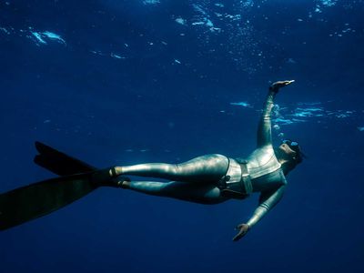 A woman free diving off the coast of South Africa