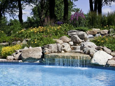 The beautiful poolside of a waterfall with rocks