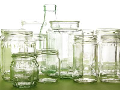 Variety of empty clear glass bottles and jars