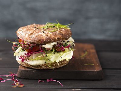 Veggie Burger, vegan, with salad, radish, tomato, rock chive