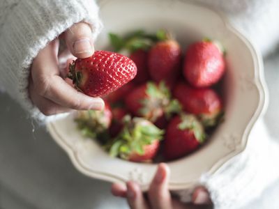 Woman Hands Holding Vintage Bowl With Sweet Strawberries