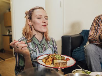 happy woman eating vegan food