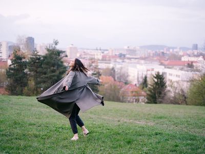 happy woman in city park