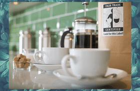 Coffee maker and cups including a bag of fair trade coffee